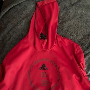 a red adidas sweatshirt,good for the fall and winter time super comfy